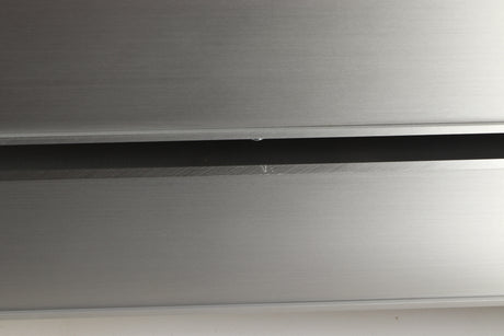 Close up view of a used Densen 2NRG PSU in Albino finish showing a scratch on the right side edge