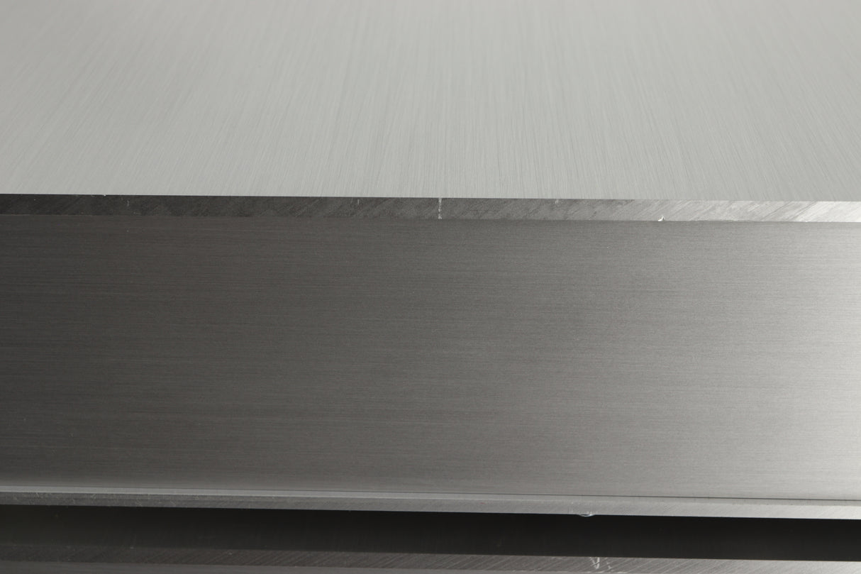 Close up view of a used Densen B-475 CD Player in Albino finish showing a scratch on the right side edge