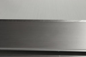 Close up view of a used Densen B-475 CD Player in Albino finish showing a scratch on the right side edge