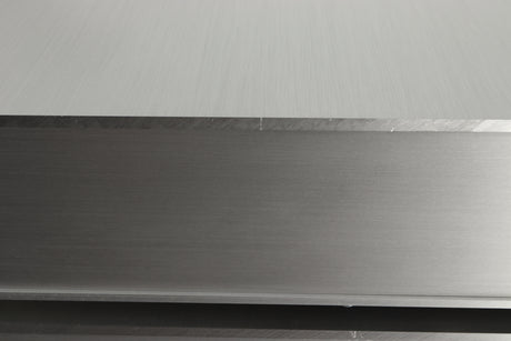 Close up view of a used Densen B-475 CD Player in Albino finish showing a scratch on the right side edge