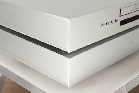 Front left corner view of a used Densen B-475 CD Player and a 2NRG PSU in Albino finish