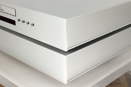 Front right corner view of a used Densen B-475 CD Player and a 2NRG PSU in Albino finish