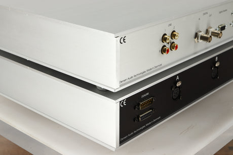 Rear left corner view of a used Densen B-475 CD Player and a 2NRG PSU in Albino finish