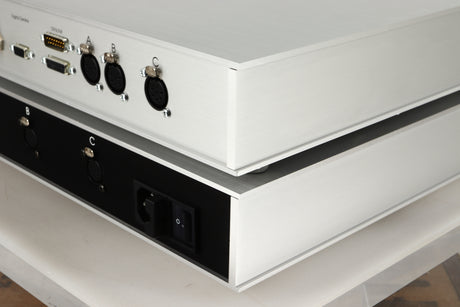 Rear right corner view of a used Densen B-475 CD Player and a 2NRG PSU in Albino finish