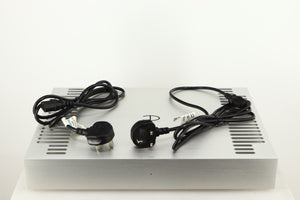 Top of a used Densen B350Plus Monoblock Power Amplifier in a silver finish showing 2x Mains Cables