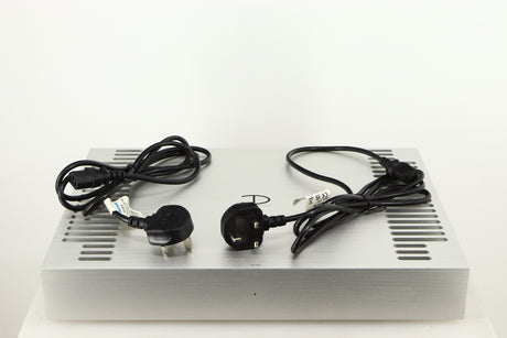 Top of a used Densen B350Plus Monoblock Power Amplifier in a silver finish showing 2x Mains Cables