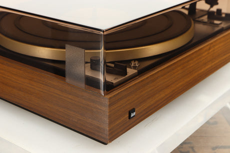 Front left corner of a used Dual 601 Turntable / Goldring 1042 Cartridge in a walnut finish 