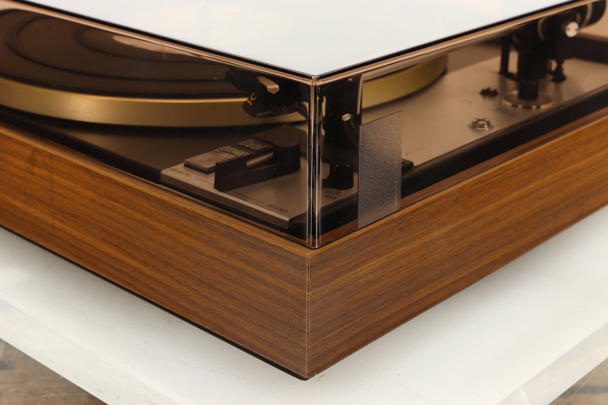 Front right corner of a used Dual 601 Turntable / Goldring 1042 Cartridge in a walnut finish 
