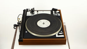 Left side view of a used Dual 601 Turntable / Goldring 1042 Cartridge in a walnut finish 
