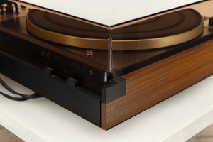 Rear left corner of a used Dual 601 Turntable / Goldring 1042 Cartridge in a walnut finish 