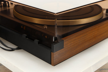 Rear left corner of a used Dual 601 Turntable / Goldring 1042 Cartridge in a walnut finish 
