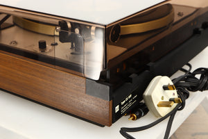 Rear right corner of a used Dual 601 Turntable / Goldring 1042 Cartridge in a walnut finish 