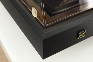 Close up of a used Dual CS 505-4 Turntable in a black finish showing a scratch