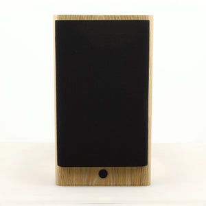 Front view of a used Dynaudio Focus 10 Standmount Speaker in a blonde finish showing Grille