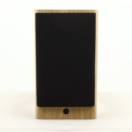 Front view of a used Dynaudio Focus 10 Standmount Speaker in a blonde finish showing Grille
