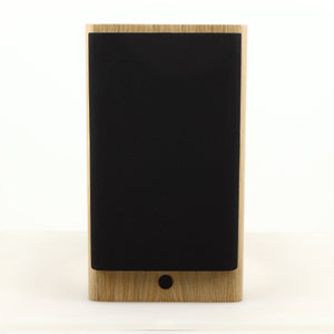 Front view of a used Dynaudio Focus 10 Standmount Speaker in a blonde finish showing Grille