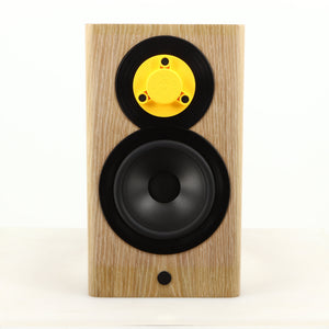 Front view of a used Dynaudio Focus 10 Standmount Speaker in a blonde finish showing Tweeter Guard