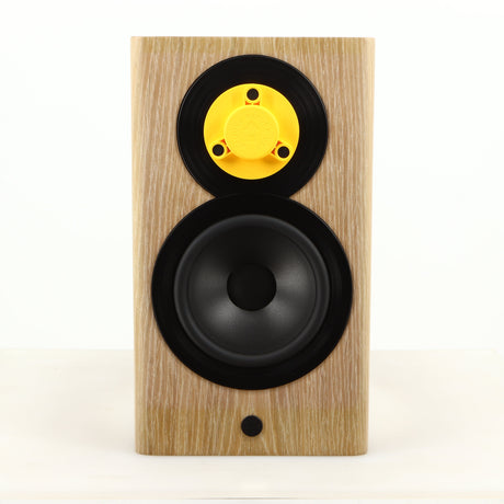 Front view of a used Dynaudio Focus 10 Standmount Speaker in a blonde finish showing Tweeter Guard