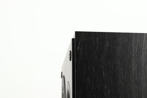 Close up of a used Dynaudio Audience 7 Standmount Speaker in a black finish showing scratching on right side