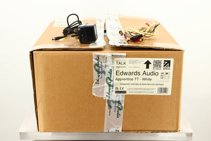 Box of a used Edwards Audio Apprentice Turntable in White finish showing mains cable, and interconnects 