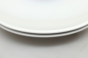 Close up view of a used Edwards Audio Apprentice Turntable in White finish showing some small dents on the side