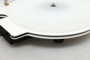 Close up view of a used Edwards Audio Apprentice Turntable in White finish showing some small dents on the side
