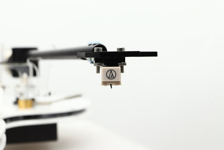 Close up view of a used Edwards Audio Apprentice Turntable in White finish showing the stylus