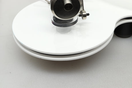 Close up view of a used Edwards Audio Apprentice Turntable in White finish showing some small dents on the side