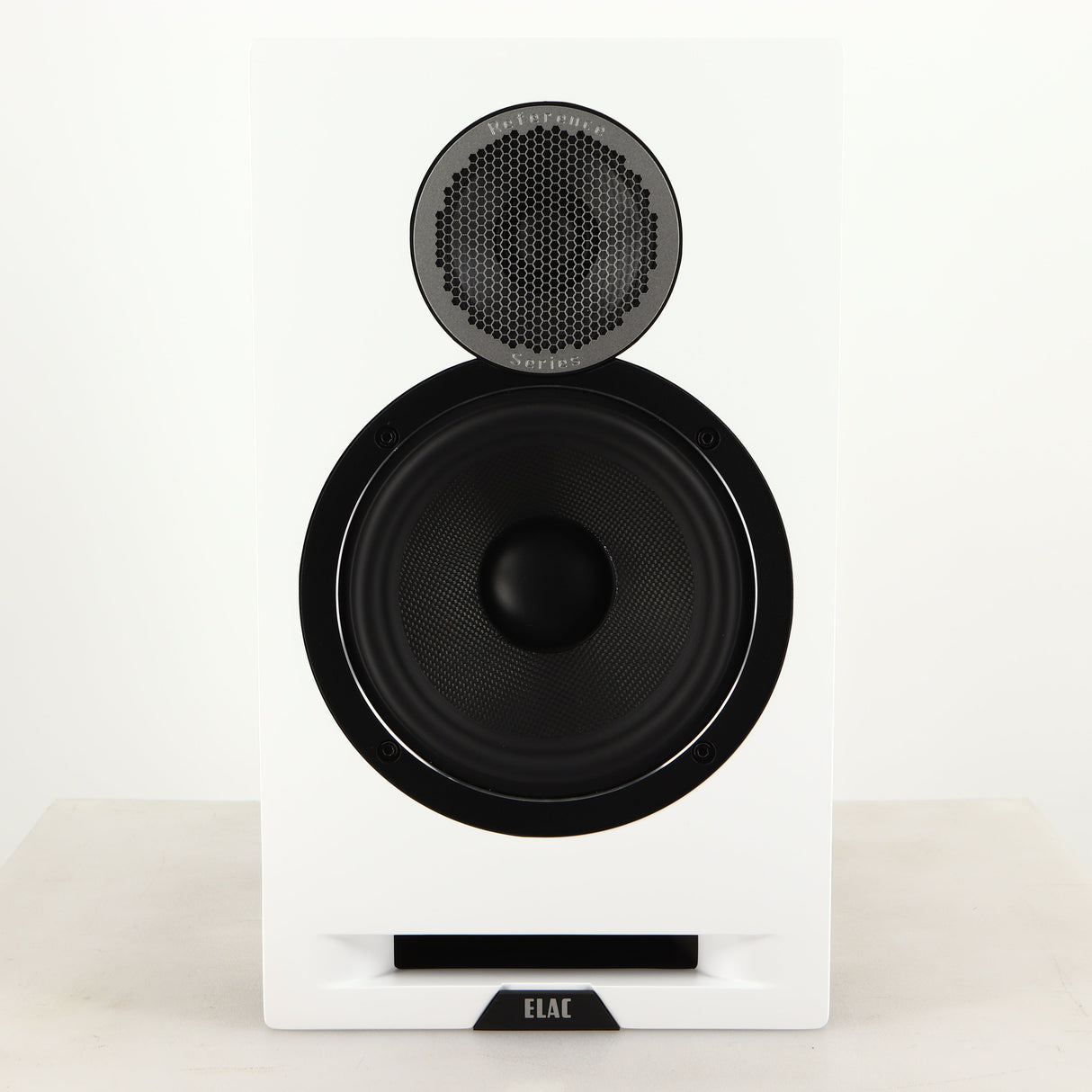 Front view of a used ELAC DBR62 Standmount Speaker in a light oak finish