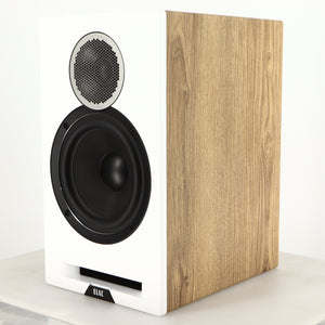 Front right corner of a used ELAC DBR62 Standmount Speaker in a light oak finish