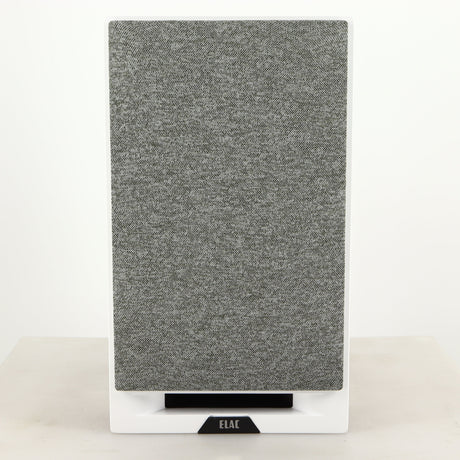 Front view of a used ELAC DBR62 Standmount Speaker in a light oak finish showing grille