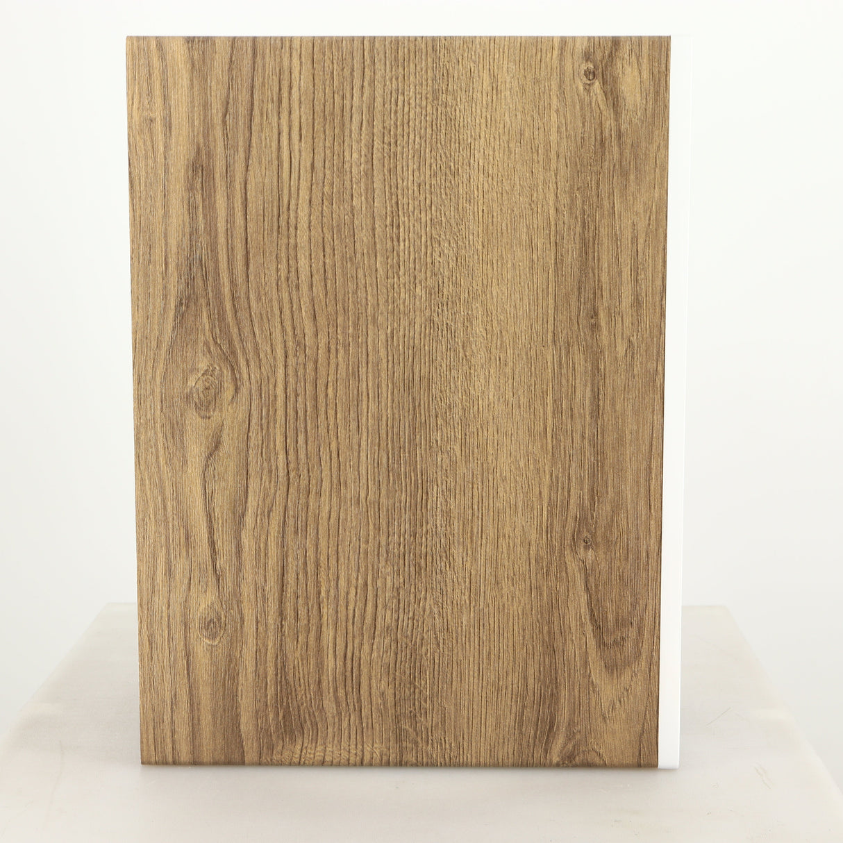 Left side view of a used ELAC DBR62 Standmount Speaker in a light oak finish