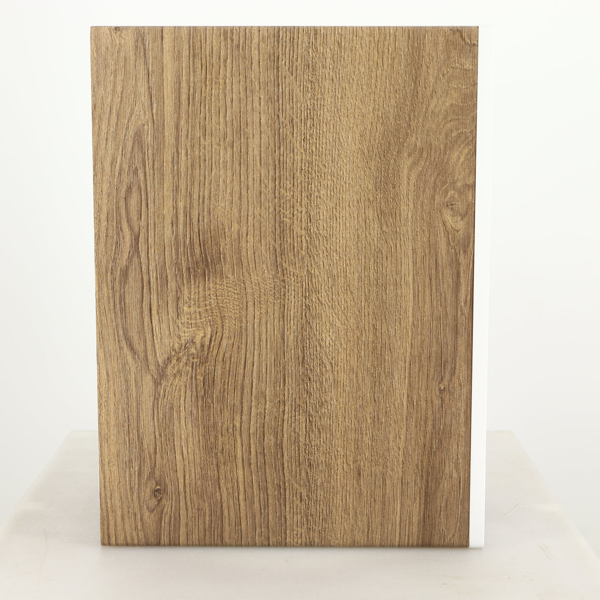 Left side view of a used ELAC DBR62 Standmount Speaker in a light oak finish