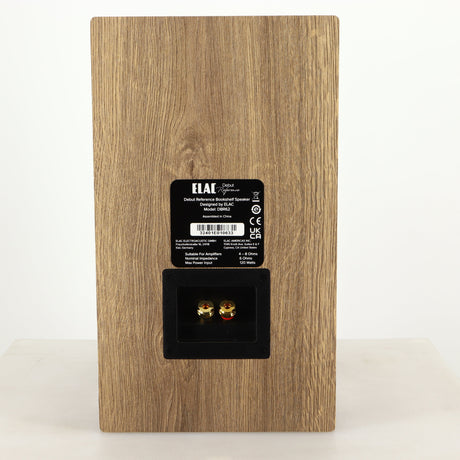 Rear view of a used ELAC DBR62 Standmount Speaker in a light oak finish