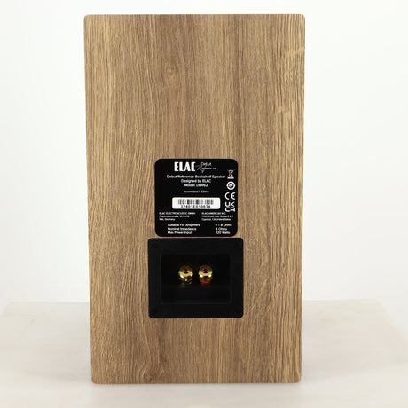 Rear view of a used ELAC DBR62 Standmount Speaker in a light oak finish