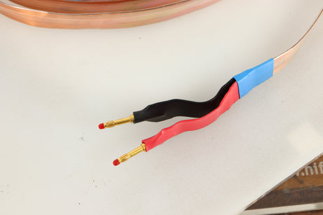 Close up view of a 3.0m ElectroFluidics Monolith 20/20 Speaker Cable 