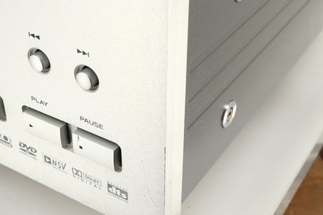 Close up of a used Esoteric DV-50s DVD Player in a silver finish showing some scratching on fascia