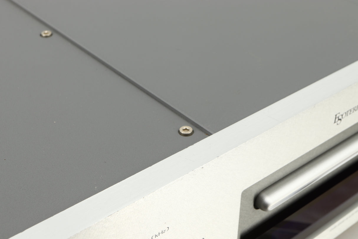 Close up of a used Esoteric DV-50s DVD Player in a silver finish showing some scratches on top edge
