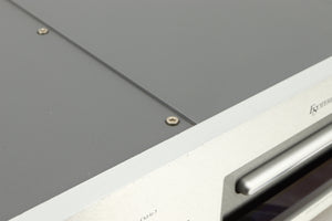 Close up of a used Esoteric DV-50s DVD Player in a silver finish showing some scratches on top edge