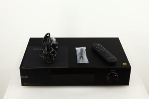Top of a used Eversolo DMP A8 Streamer / Pre Amplifier / DAC in a black finish showing Mains Cable, Manual, Screwdriver and Remote 