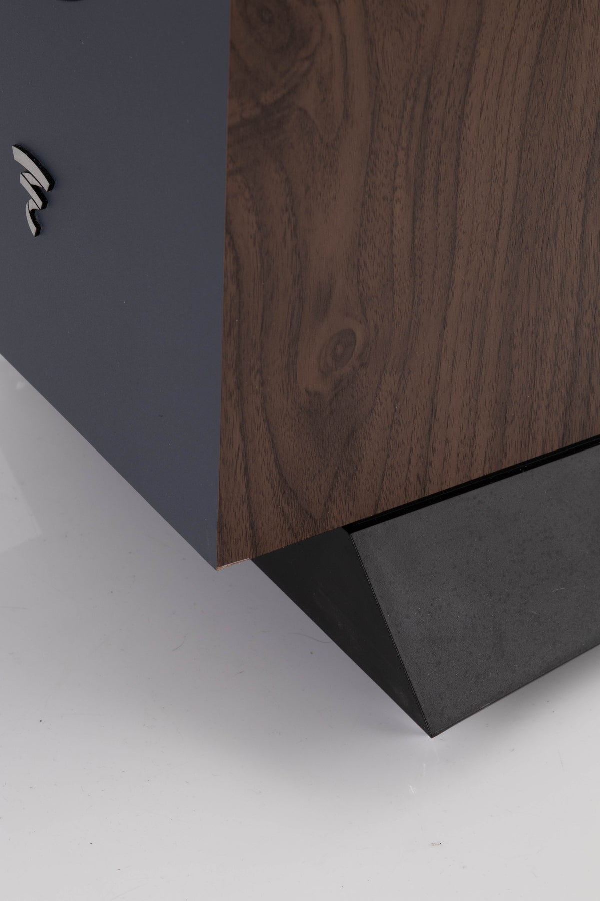 Close up view of a used Focal Chora 826 Floorstanding Speaker in Dark Wood showing some damage on the bottom corner 