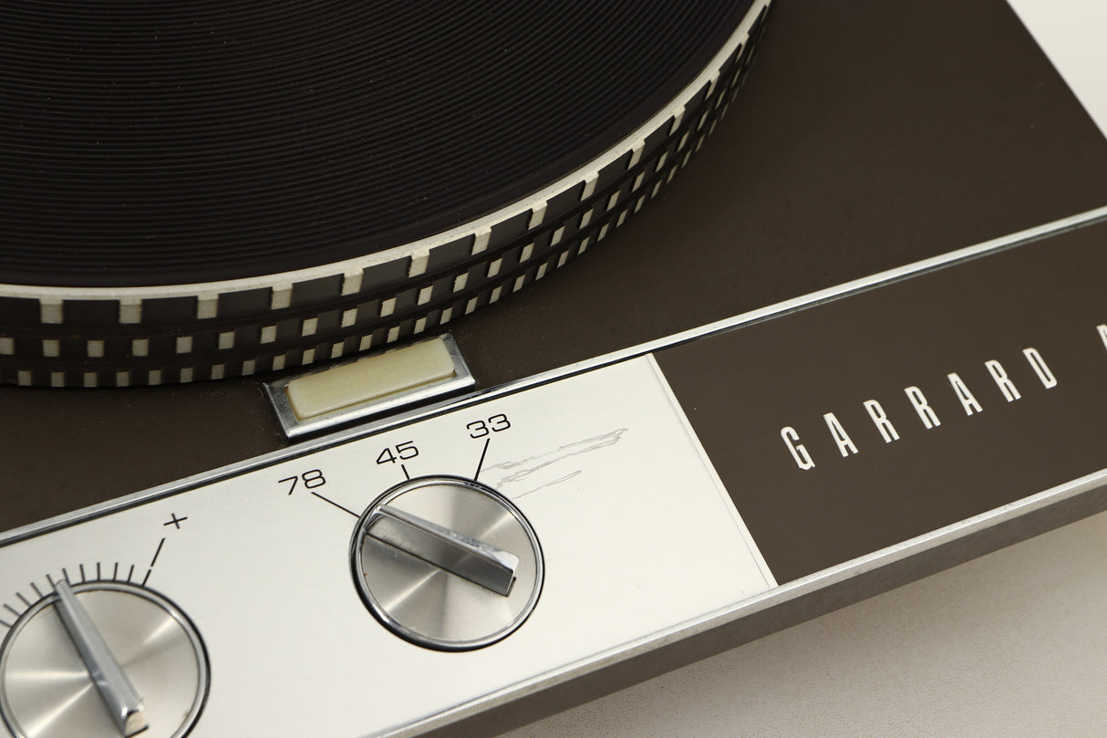 Close up view of a used Garrard 401 Turntable showing a scratch