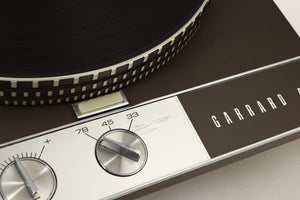 Close up view of a used Garrard 401 Turntable showing a scratch