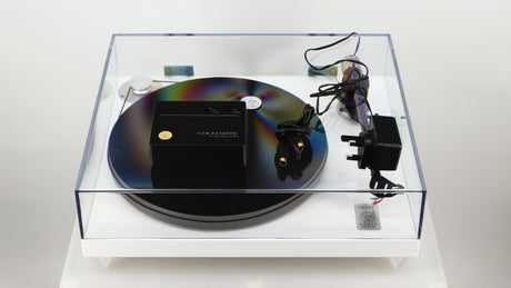 Top of a used Gold Note Valore 425 Plus Turntable W/ Tonearm in a white finish showing Speed Control, PSU and DIN Cable 