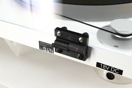 Close up of a used Gold Note Valore 425 Plus Turntable W/ Tonearm in a white finish showing crack along rear