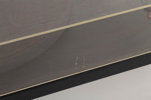 Close up of a used Goldring GR1.2 Turntable showing scratching on lid