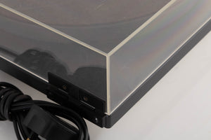 Rear left corner of a used Goldring GR1.2 Turntable