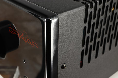 Close up of a used Graaf GM50 Integrated Amplifier in a black finish showing scratch on right side
