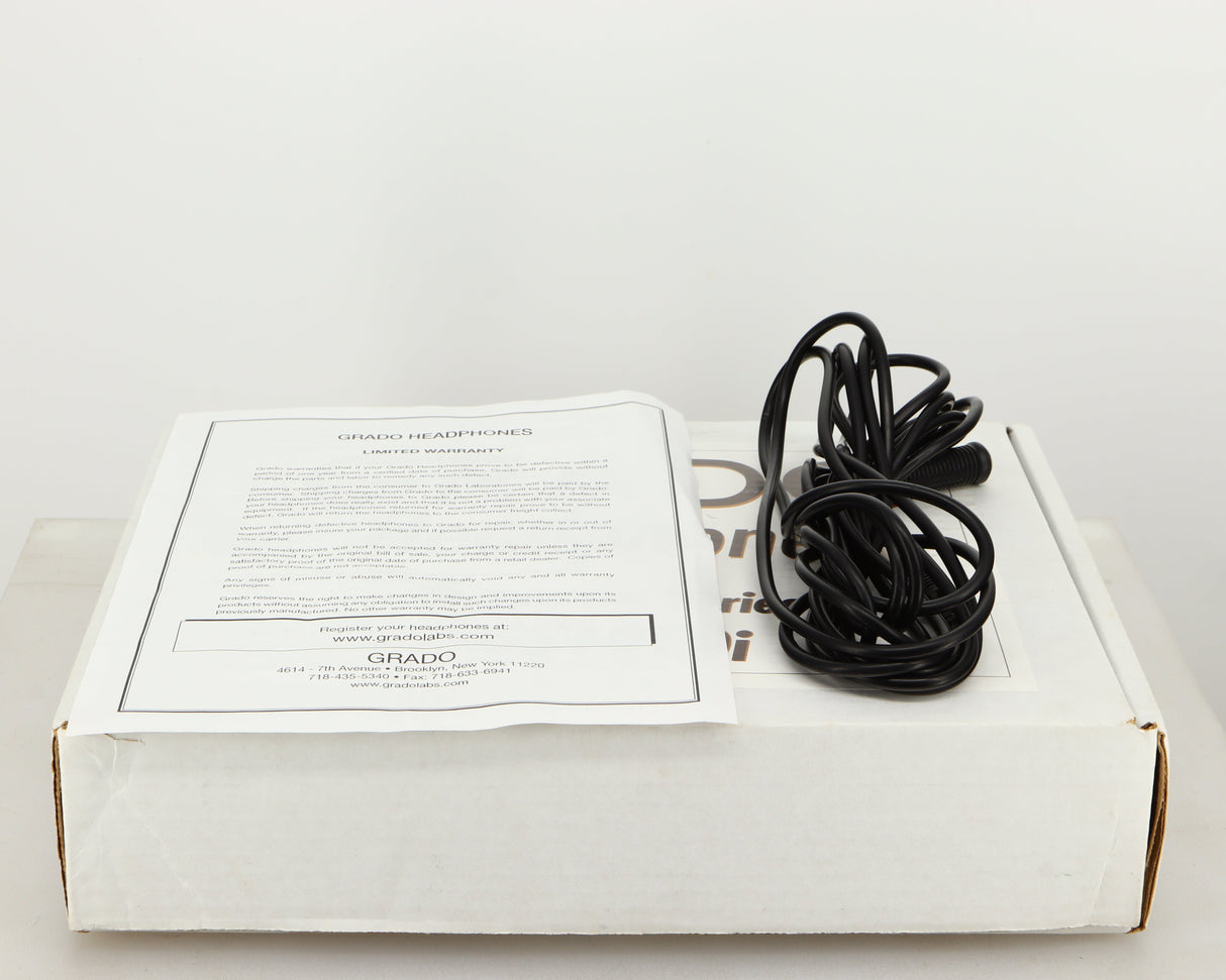 Box for used Grado GS1000i Headphones showing Warranty Card and Headphone Cable