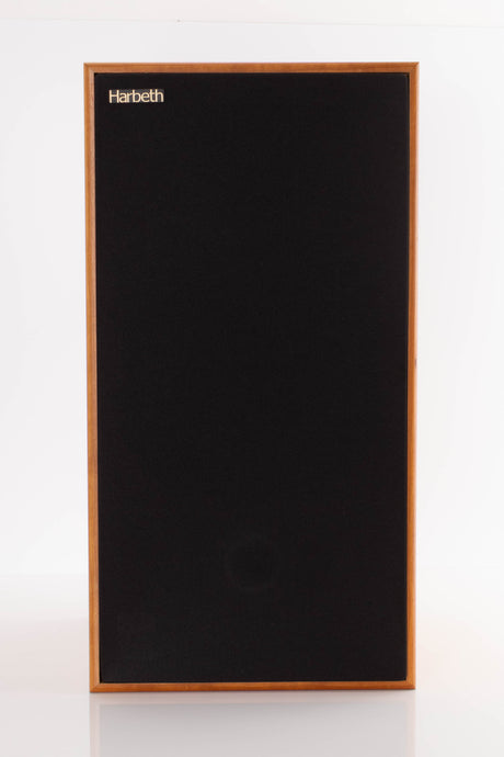 Front view of a used Harbeth Compact 7ES 3 Standmount Speaker in a Cherry finish showing Grille